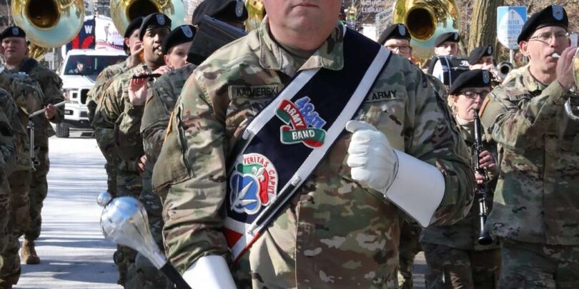 Staff Sergeant Jeff Kazmierski, 484th Army Band, leads a former Vets Day Parade; image for a Veterans Day 2022 blog post