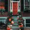 Image of pumpkins in front of stairs for Thanksgiving and Friendsgiving 2024 Blog post at Bloggey.com - Images free courtesy of Pexels.com at https://www.pexels.com/photo/pumpkins-on-stairs-in-front-of-a-door-3142467/